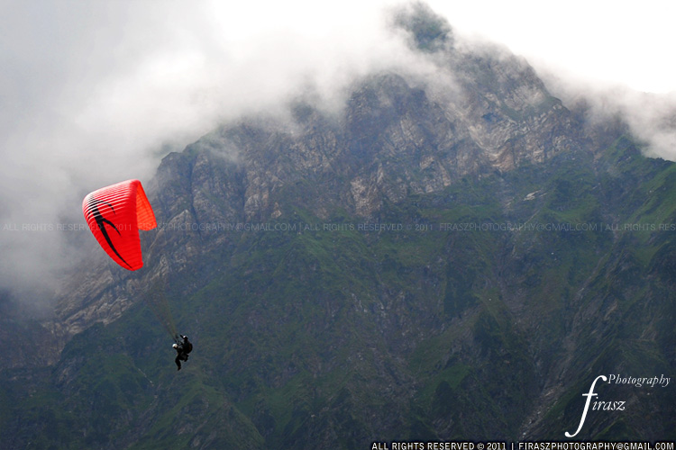 Paragliding between the clouds
